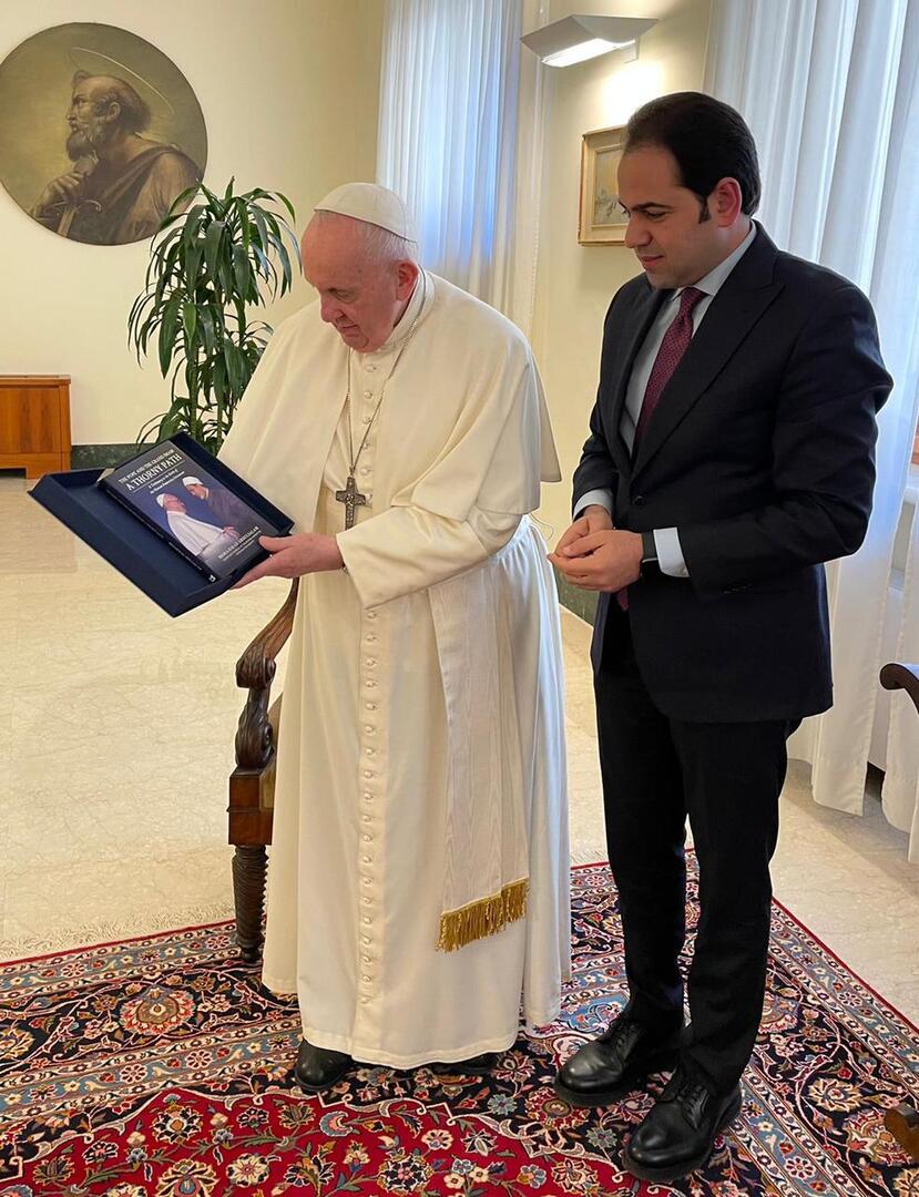 Judge Mohamed Abdel Salal presents ‘The Pope and the Grand Imam: A Thorny Path’ to Pope Francis at the Vatican on April 8. (Photo provided by Judge Mohamed Abdel Salam)