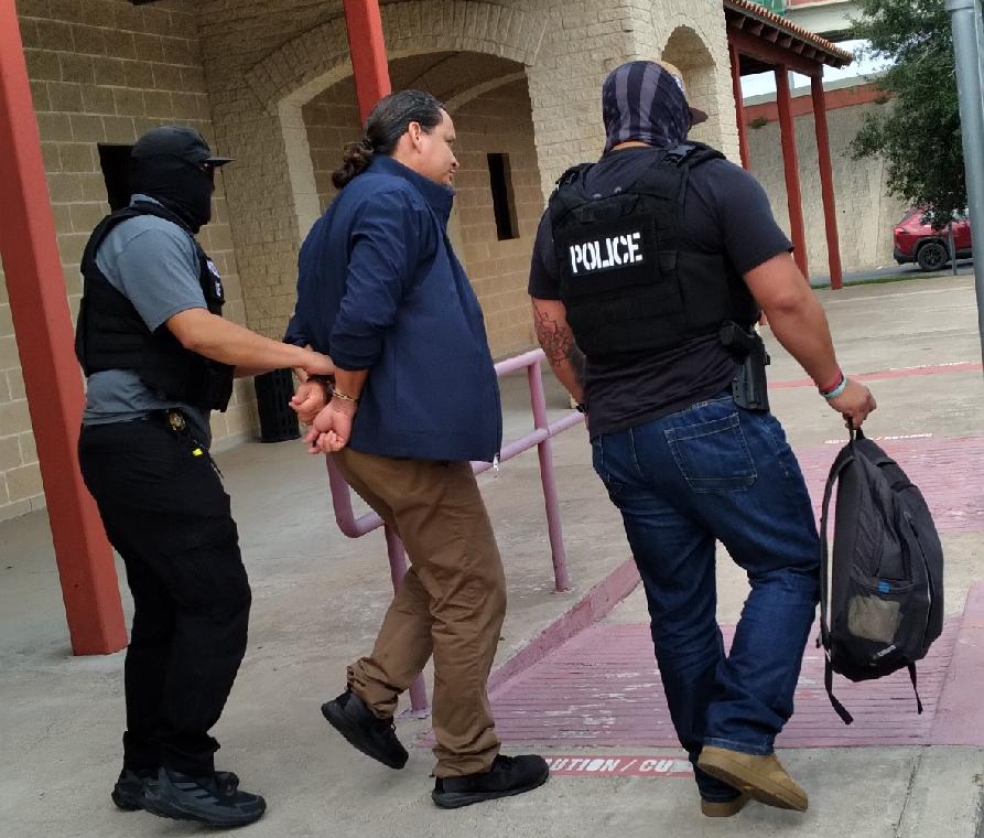 Carlos being detained by ICE outside of Immigration Court in Harlingen, TX (Photo provided by authors)