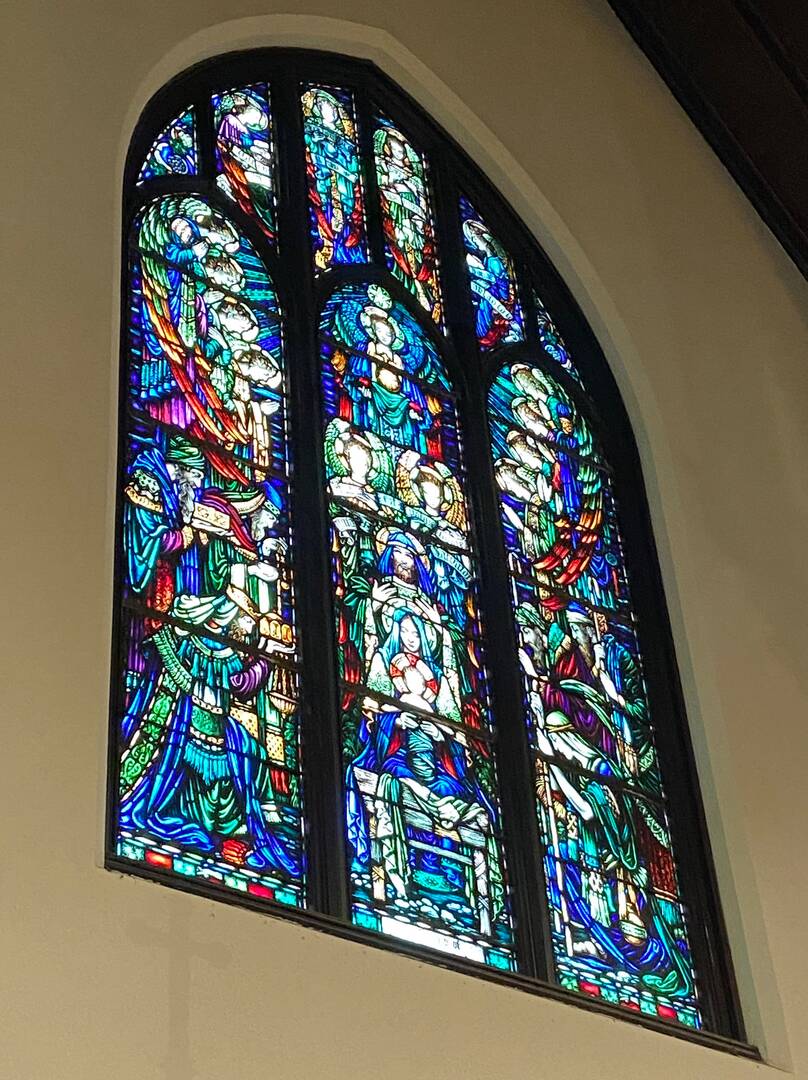 chancel window with beautiful image of jesus and family