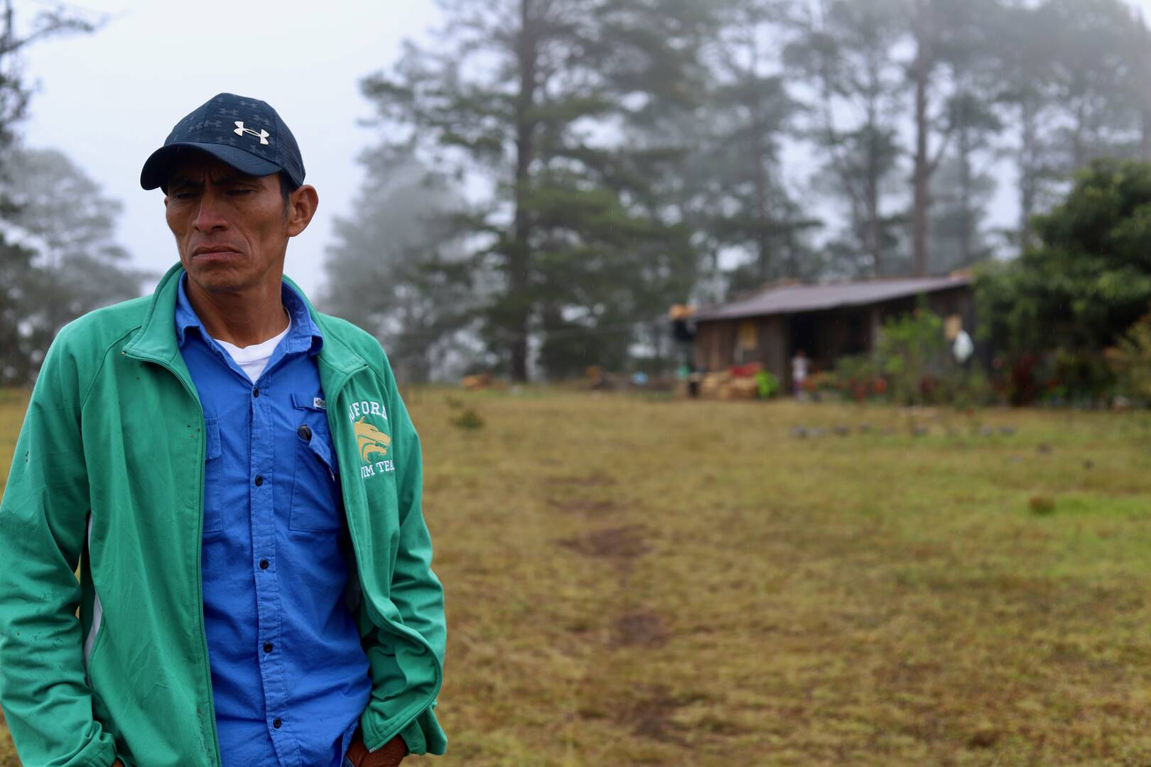 A Honduran farmer outside his home
