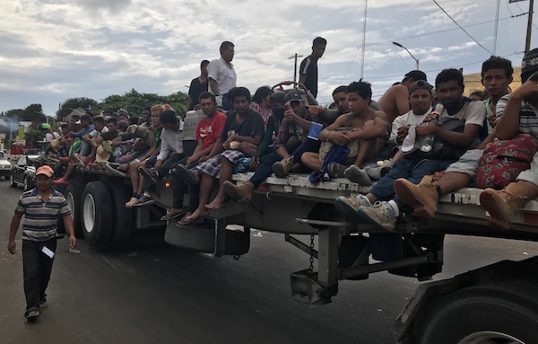 There were complaints of younger men securing coveted spots on the trailers and flatbed trucks, while women, children and the elderly were forced to continue on foot.