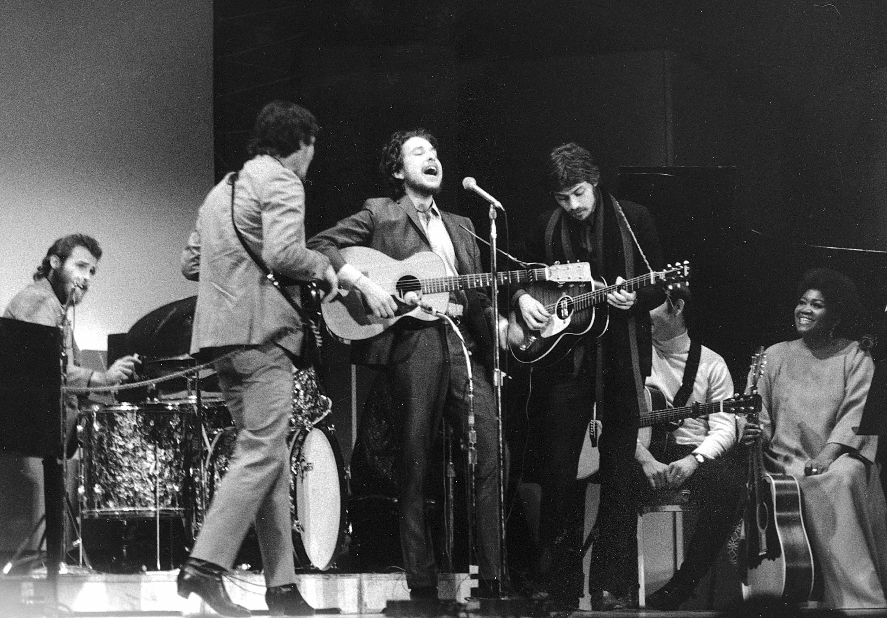 Bob Dylan, center, performs with drummer Levon Helm, left, Rick Danko, second left, and Robbie Robertson of The Band at Carnegie Hall in New York City on Jan. 20, 1968. The concert was part of a benefit tribute to the late folk singer-songwriter Woody Guthrie (AP Photo).