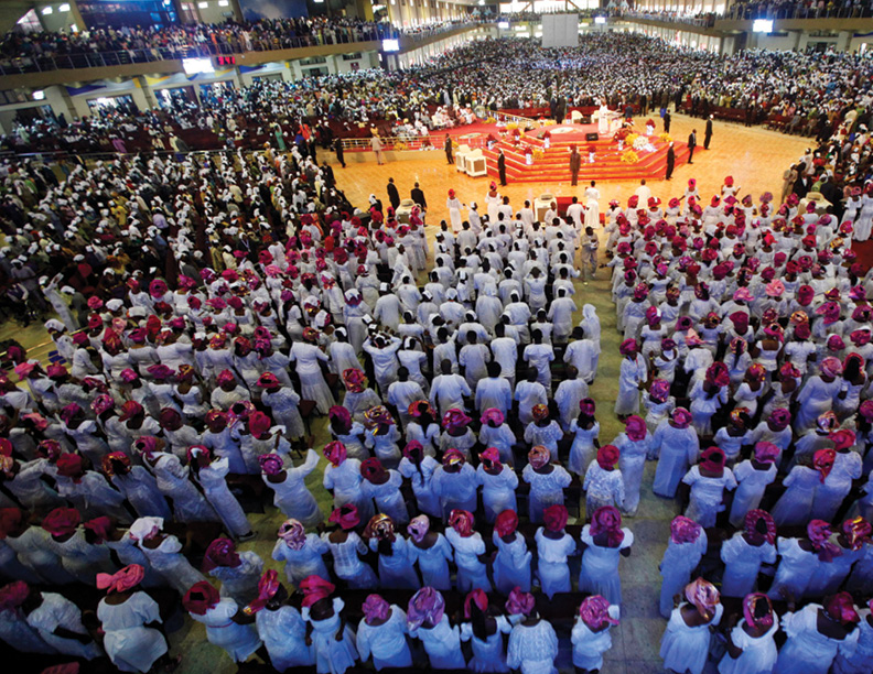 Worshippers, dressed in traditional attire, attend a church service at the Living Faith Church, also known as the Winners' Chapel, in Ota district, Ogun state, Sept. 28, 2014. REUTERS/Akintunde Akinleye