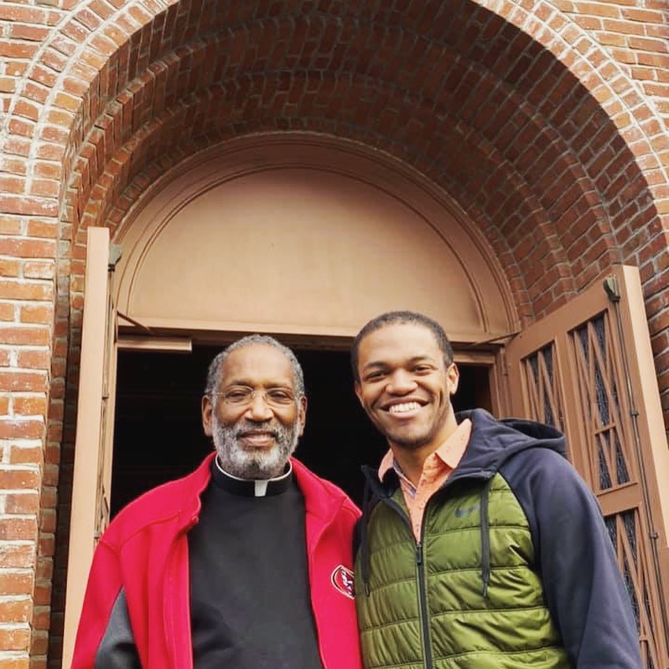 Nate Tinner-Williams with his parish priest