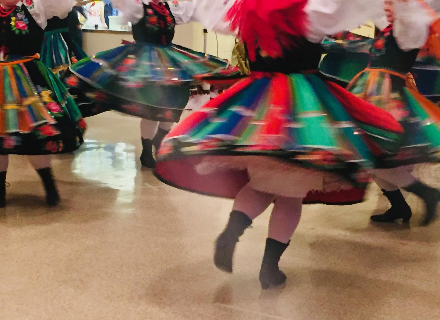 Girls in folk costumes dance at the 22nd annual paczki celebration at Holy Mother of the Rosary Cathedral in Lancaster, N.Y.