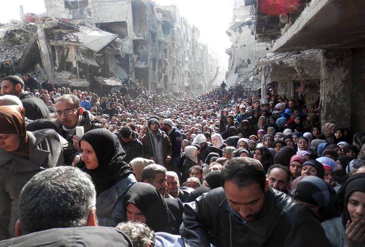 Thousands line up for 450 food parcels; 100 die each day at Yarmouk