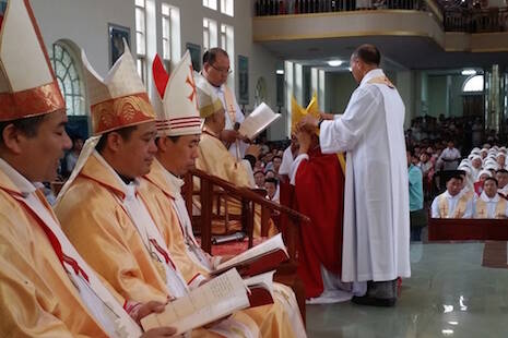 Bishop Joseph Zhang Yinlin (kneeling, center) at his ordination in Anyang on Aug. 4. (Photo credit: ucanews.com)