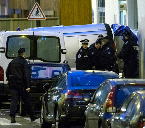 French police remove the bodies of victims after a mass shooting at the Paris offices of Charlie Hebdo, a satirical newspaper, Jan. 7. (CNS/EPA)