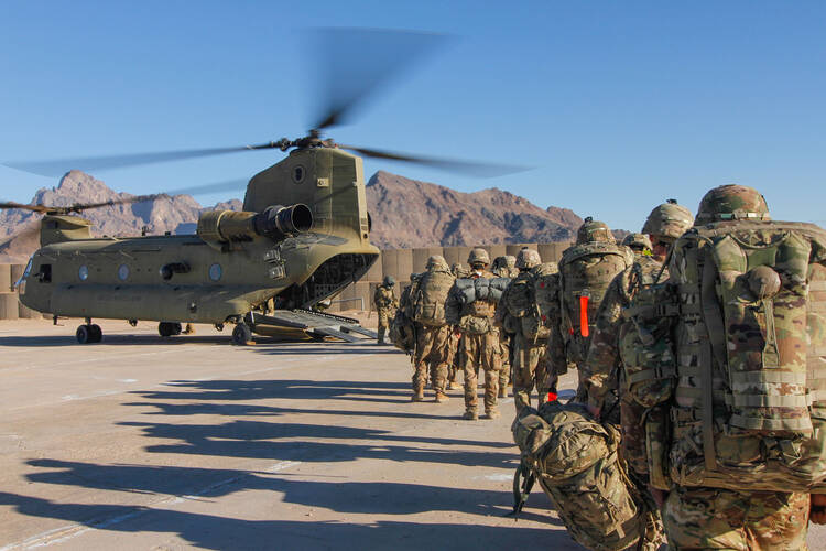 Mission impossible? U.S. soldiers assigned load onto a Chinook helicopter to head out and execute missions across Afghanistan in January 2019. Photo courtesy Department of Defense/1st Lt. Verniccia Ford