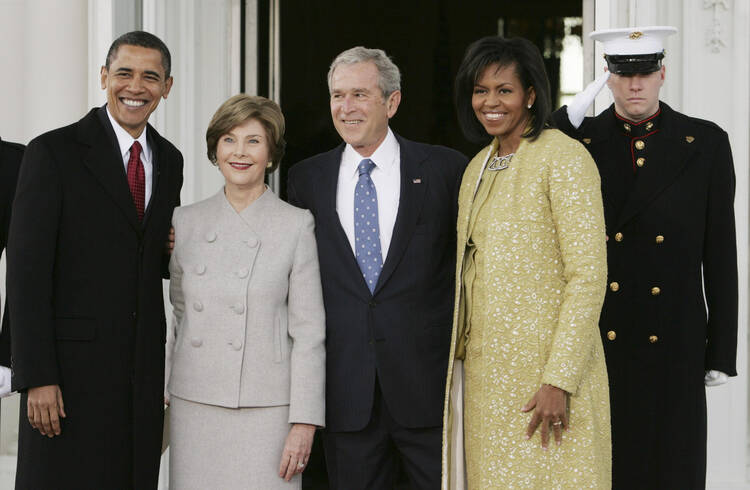 The biggest jump in voter turnout in American history resulted in a win for the guy in the middle, Republican George W. Bush. (CNS photo/Larry Downing, Reuters) 