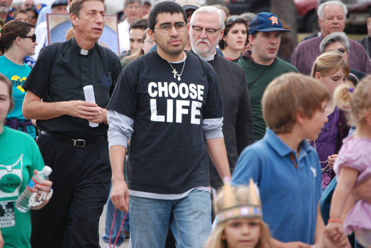 People march in protest of the death penalty and abortion in Texas. (CNS photo/Erik Noriega, Texas Catholic Herald)