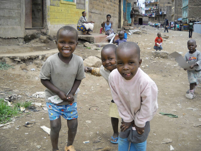 Children play in a street in Nairobi's Kariobangi slum. (CNS photo/Patricia Zapor) 