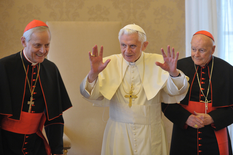Pope Benedict XVI is flanked by Cardinal Donald W. Wuerl of Washington, left, and Cardinal Theodore E. McCarrick, retired archbishop of Washington, during a Jan. 19 meeting with U.S. bishops on their âad liminaâ visits to the Vatican. In a speech to the bishops, the pope issued a strong warning about threats to freedom of religion and conscience in the U.S. (CNS photo/LâOsservatore Romano) (Jan. 19, 2012)