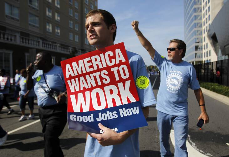Chris Martin, center, marches with Local 5285 in a Labor Day parade ahead of the 2012 Democratic National Convention. (CNS photo/Jessica Rinaldi, Reuters)