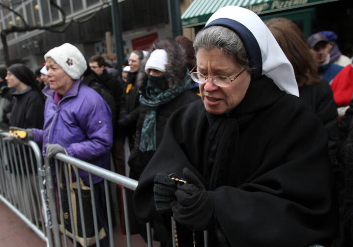 Nun prays outside abortion clinic in New York. (CNS photo/Gregory A. Shemitz) 