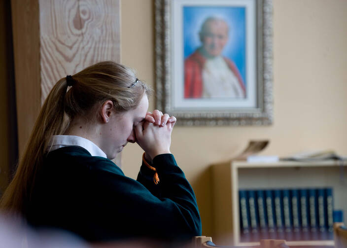 Senior at Virginia Catholic school prays for cardinals gathered in Sistine Chapel for papal conclave (CNS photo/Matthew Barrick)