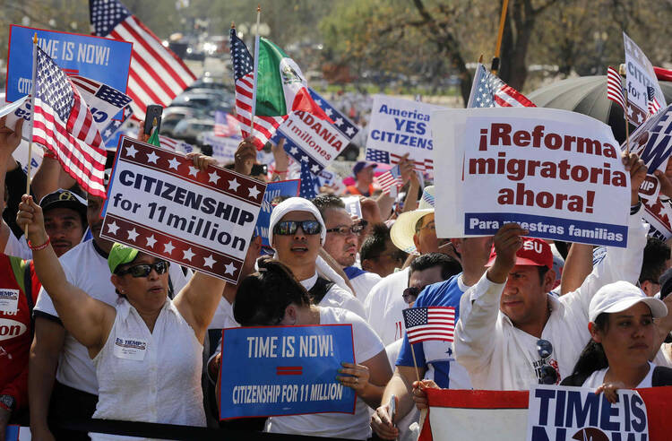 People rally in Washington for comprehensive immigration reform. (CNS photo/Larry Downing, Reuters) 