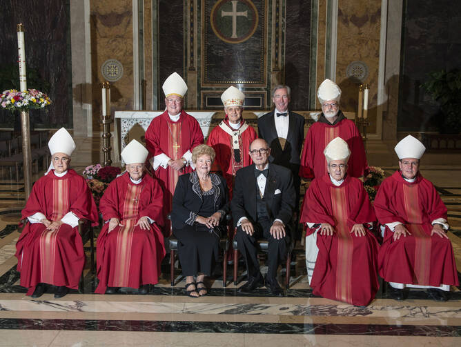 Archbishop Viganò seated next to then-Cardinal McCarrick, front row on left, along with other U.S. cardinals, Glory and Thomas Sullivan and John Garvey, at a fundraiser on May 10, 2013. (CNS photo/Edmund Pfueller, Catholic University of America)