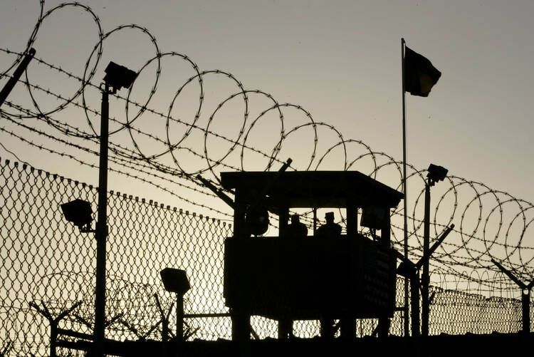 U.S. Army troops stand guard over Sally Port One at Camp Delta in 2006 where detainees are held at the U.S. Naval Base in Guantanamo Bay, Cuba. (CNS photo/Joe Skipper, Reuters)