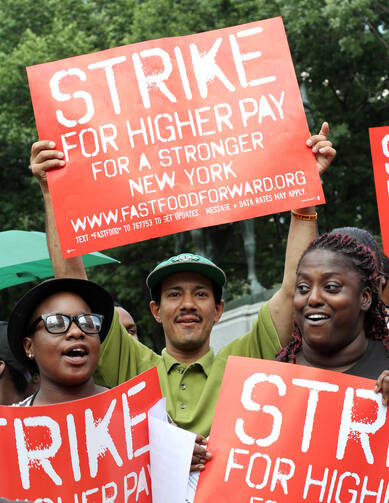 Fast-food workers and supporters demand higher wages during rally in New York (CNS photo/Gregory A. Shemitz)