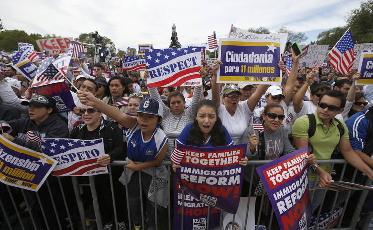 Hundreds of protesters calling for comprehensive immigration reform gather at a rally on the National Mall in Washington Oct. 8 (CNS photo/Jason Reed, Reuters)