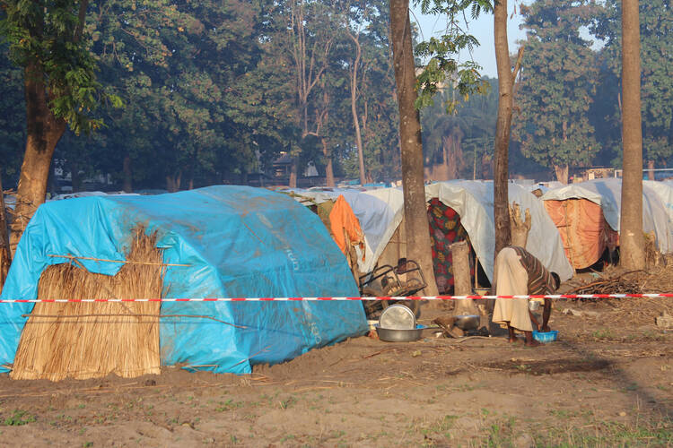 Woman washes clothes on diocesan compound in Central African Republic (CNS photo/courtesy Bishop Nongo)