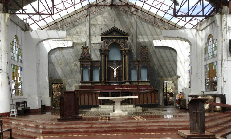 Standing water is seen in the altar area Nov. 20 of the roofless St. Lawrence the Martyr Church in the coastal Philippine town of Balangig,a devastated by super typhoon Haiyan (CNS photo/Nathan Layne, Reuters)