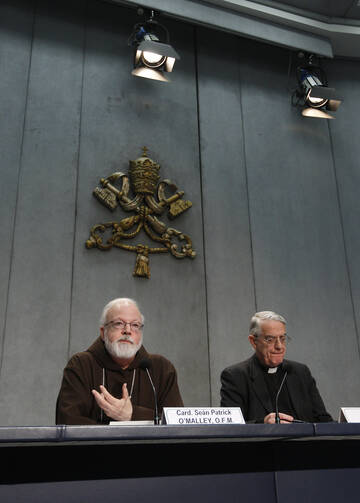Boston Cardinal O'Malley and Jesuit Father Lombardi lead press conference at the Vatican (CNS photo/Paul Haring)