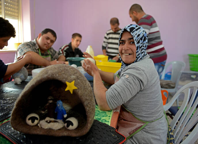 Palestinians with intellectual disabilities make felted wool ornaments, Nativity sets and other gift items from the wool of Bethlehem sheep at the Ma'an lil-Hayat in Bethlehem. (CNS photo/Debbie Hill)
