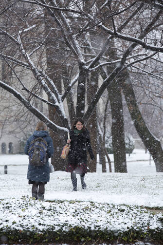 Students walk amid the snowfall on campus of Catholic University of America in Washington D.C. (CNS photo/Tyler Orsburn) (Dec. 10, 2013)