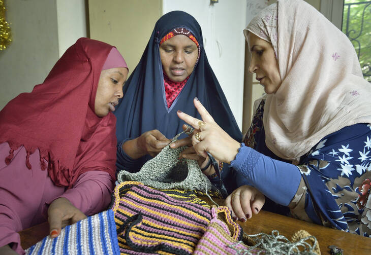 Refugee women in Cairo participate in a sewing and knitting class in early November, 2013. The class was sponsored by St. Andrew's Refugee Services, which is supported by Catholic Relief Services. (CNS photo/Paul Jeffrey) (Jan. 2, 2014)