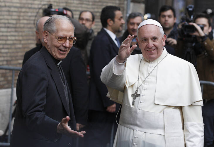 Pope Francis greets crowd as he arrives to celebrate Mass at Church of the Gesu in Rome.