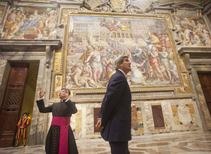 U.S. Secretary of State John Kerry tours the "Sala Regia," the "royal room" of the Vatican, Jan. 14 with Msgr. Jose Bettencourt, the Holy See's head of protocol. (CNS photo/Pablo Martinez Monsivais, pool via Reuters) (Jan. 14, 2014)