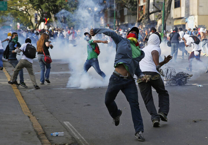 Demonstrators confront police during protests in Venezuela.