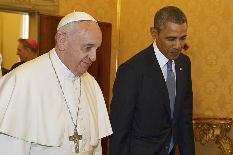 Pope Francis walks with U.S. President Obama during a private audience at the Vatican. (CNS photo/Gabriel Bouys, pool via Reuters)