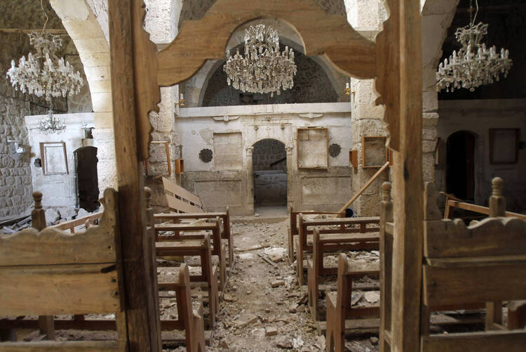 Debris seen inside damaged church in Syria.