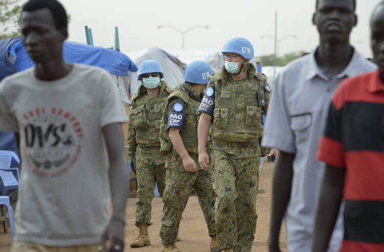 U.N. soldiers patrol a camp for internally displaced families at a U.N. base in Juba, South Sudan. (CNS photo/Paul Jeffrey) (April 23, 2014) 