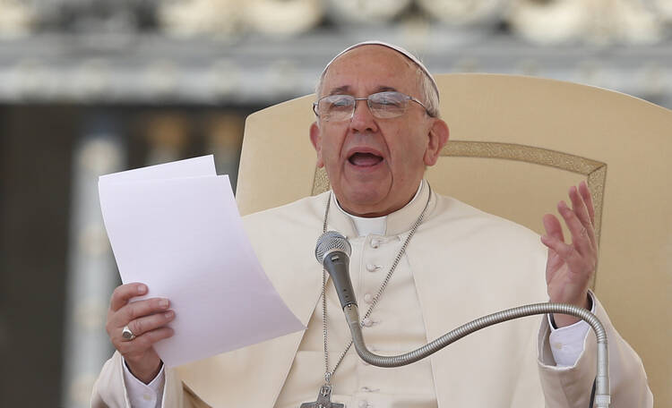 Pope Francis speaks during his general audience in St. Peter's Square at the Vatican April 30. (CNS photo/Paul Haring) 