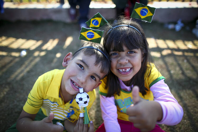 Young Brazilian fans outside the Arena Corinthians stadium in Sao Paulo (CNS photo/Diego Azubel, EPA) 