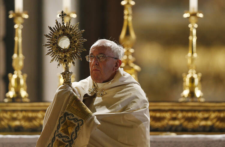 Pope Francis leads Benediction outside the Basilica of St. Mary Major as he celebrates the feast of Corpus Christi in Rome June 19. (CNS photo/Paul Haring) (June 20, 2014) 
