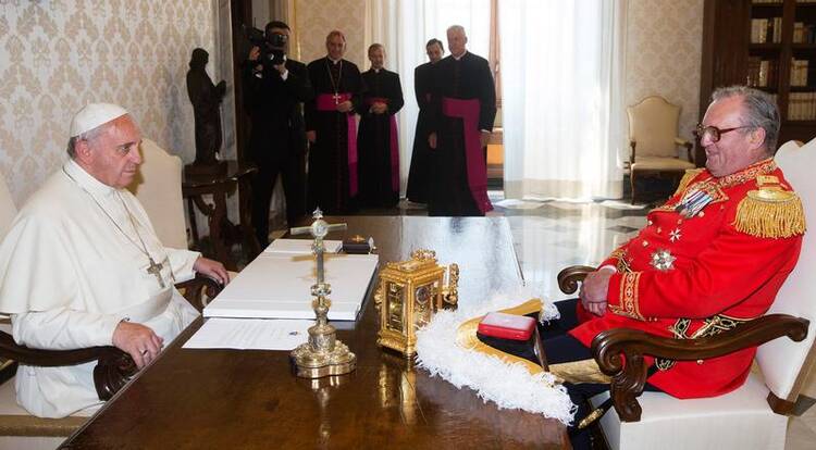 Pope Francis speaks with Fra' Matthew Festing, the 79th prince and grand master of the Sovereign Military Order of Malta, during a private audience at the Vatican June 20. (CNS photo/Claudio Peri, pool via Reuters) (June 23, 2014)