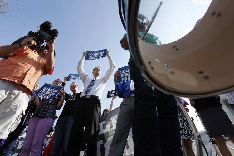 A drummer joins demonstrators outside the U.S. Supreme Court rallying against a federal mandate requiring most employers to cover contraceptives for employees as part of their health care. (CNS photo/ Jonathan Ernst) (June 30, 2014)