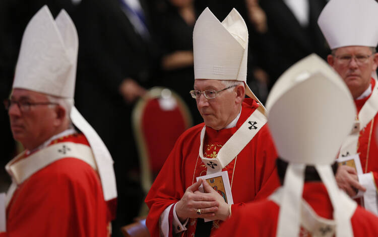Archbishop Leonard P. Blair of Hartford, Conn., center, wears his new pallium as he leaves in procession at the conclusion of a Mass celebrated by Pope Francis to mark the feast of Sts. Peter and Paul in St. Peter's Basilica at the Vatican June 29.