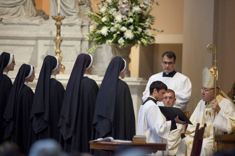 Five Dominican sisters face Nashville bishop during Mass where they made final profession of religious vows. 