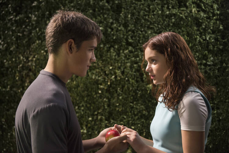 Brenton Thwaites and Odeya Rush star in a scene from the movie "The Giver." (CNS photo/courtesy The Weinstein Company) 