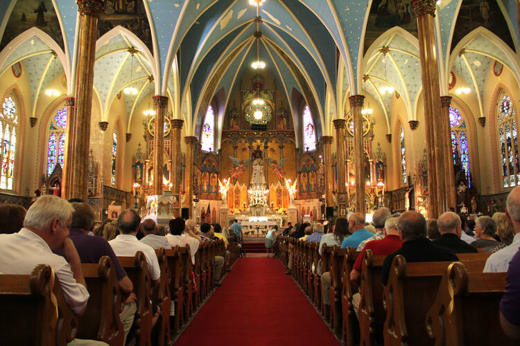 More than 2,000 people attend Mass at historic St. Albertus Church in Detroit Aug. 10. The Mass was organized as part of a "Mass mob" movement to fill now-closed historic inner-city Detroit churches for occasional Masses. St. Albertus is no longer an active parish but the church remains open as a center for Polish heritage. (CNS photo/Jonathan Francis, Archdiocese of Detroit)