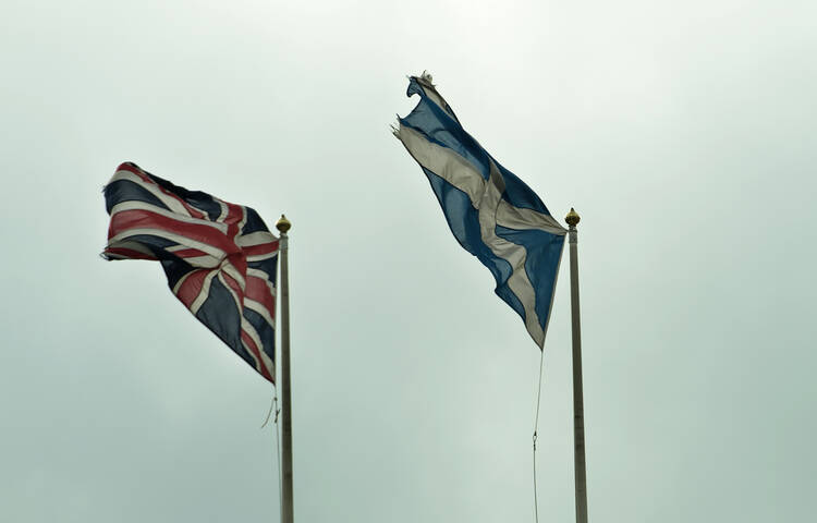 Scottish, British flags fly outside Scotland Office in London.
