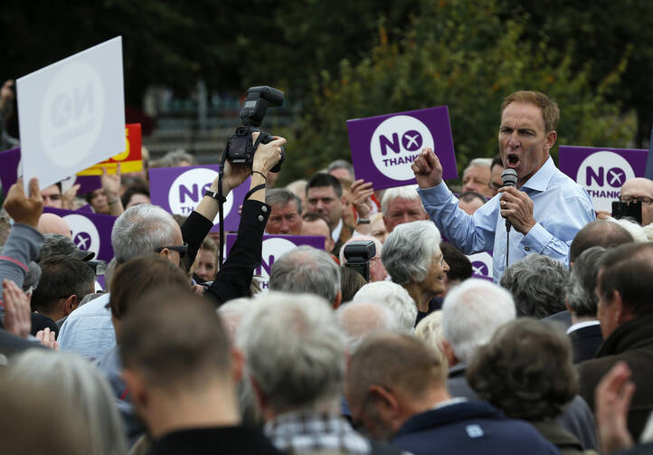Member of British Parliament addresses crowd to promote case for Scotland to remain part of the United Kingdom. (CNS photo/ Russell Cheyne, Reuters)