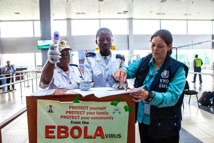 Dr. Aileen Marty, a Miami-based infectious disease expert, stops at a checkpoint in the Lagos International Airport in Nigeria. (CNS photo/courtesy Florida International University)