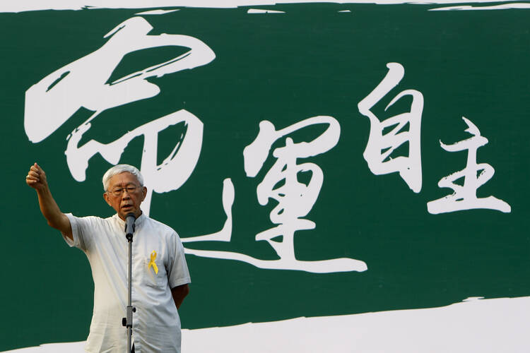 Cardinal Zen addresses rally outside Hong Kong government building. (CNS photo/Liau Chung-ren, Reuters)